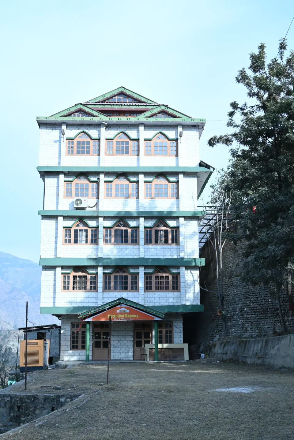 Front view of the multi-storey Hotel Atul Regency building